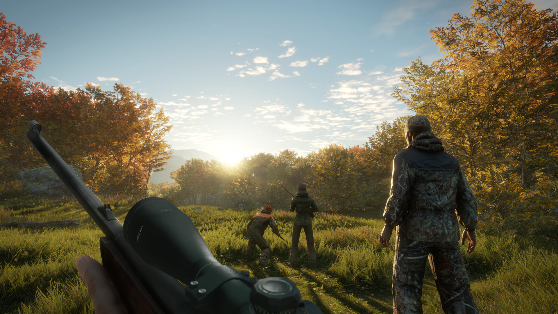 Hunters walk across a grassy field.