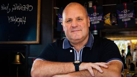 For some reason, Riot Games is creating a Valorant ‘pub’ in east London hosted by a British takeaway guy who likes to yell “bosh!”
