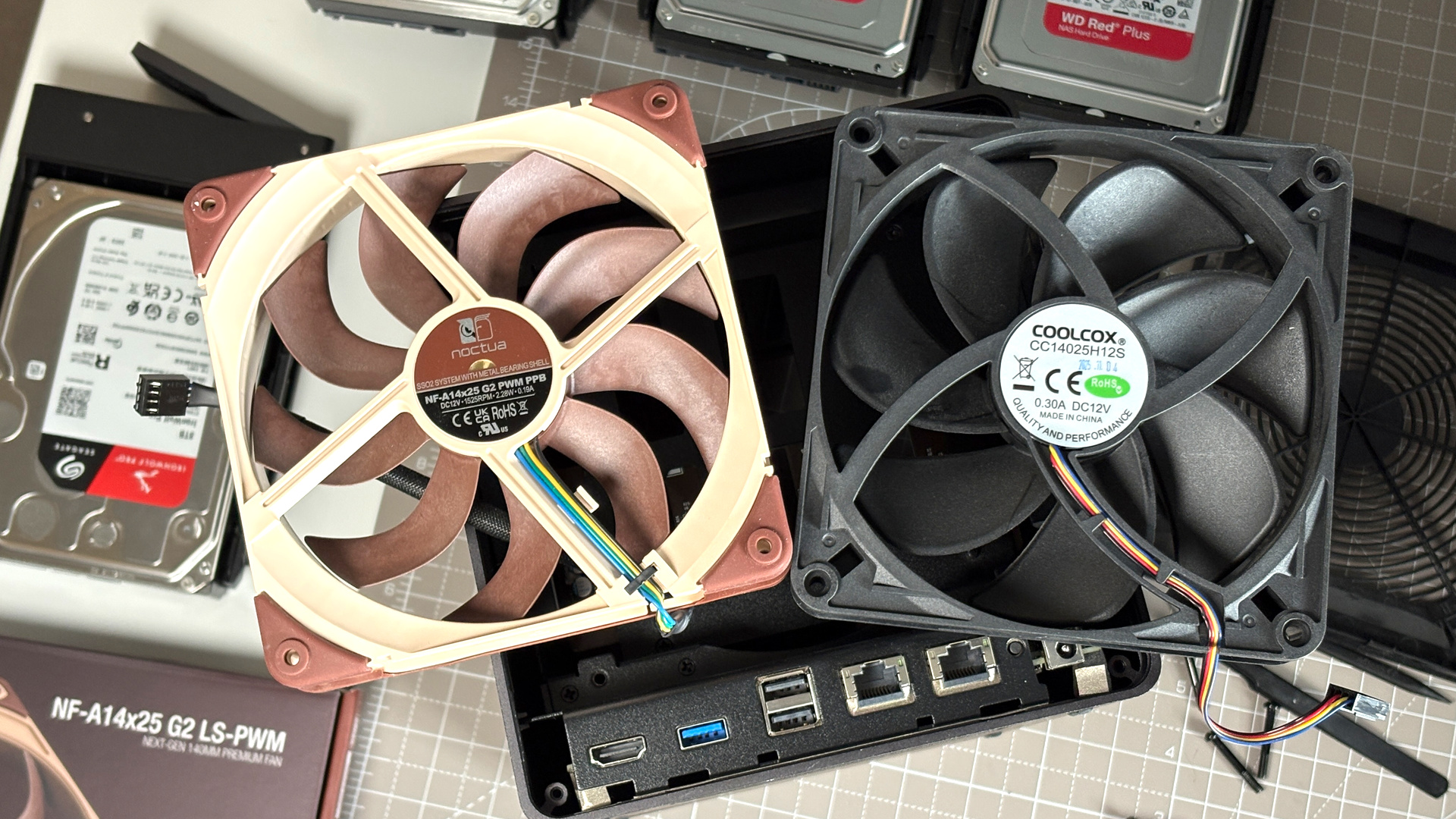 UGreen NASync DXP4800 Pro on a desk with multiple HDDs installed.
