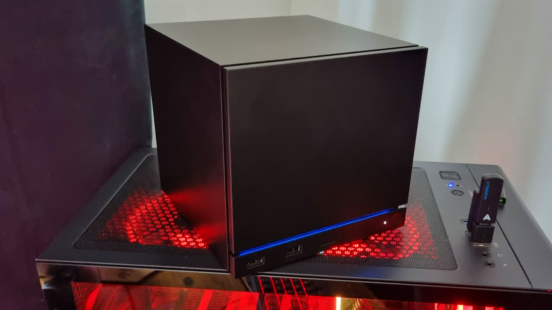 A Steam Machine riding on top of a gaming PC