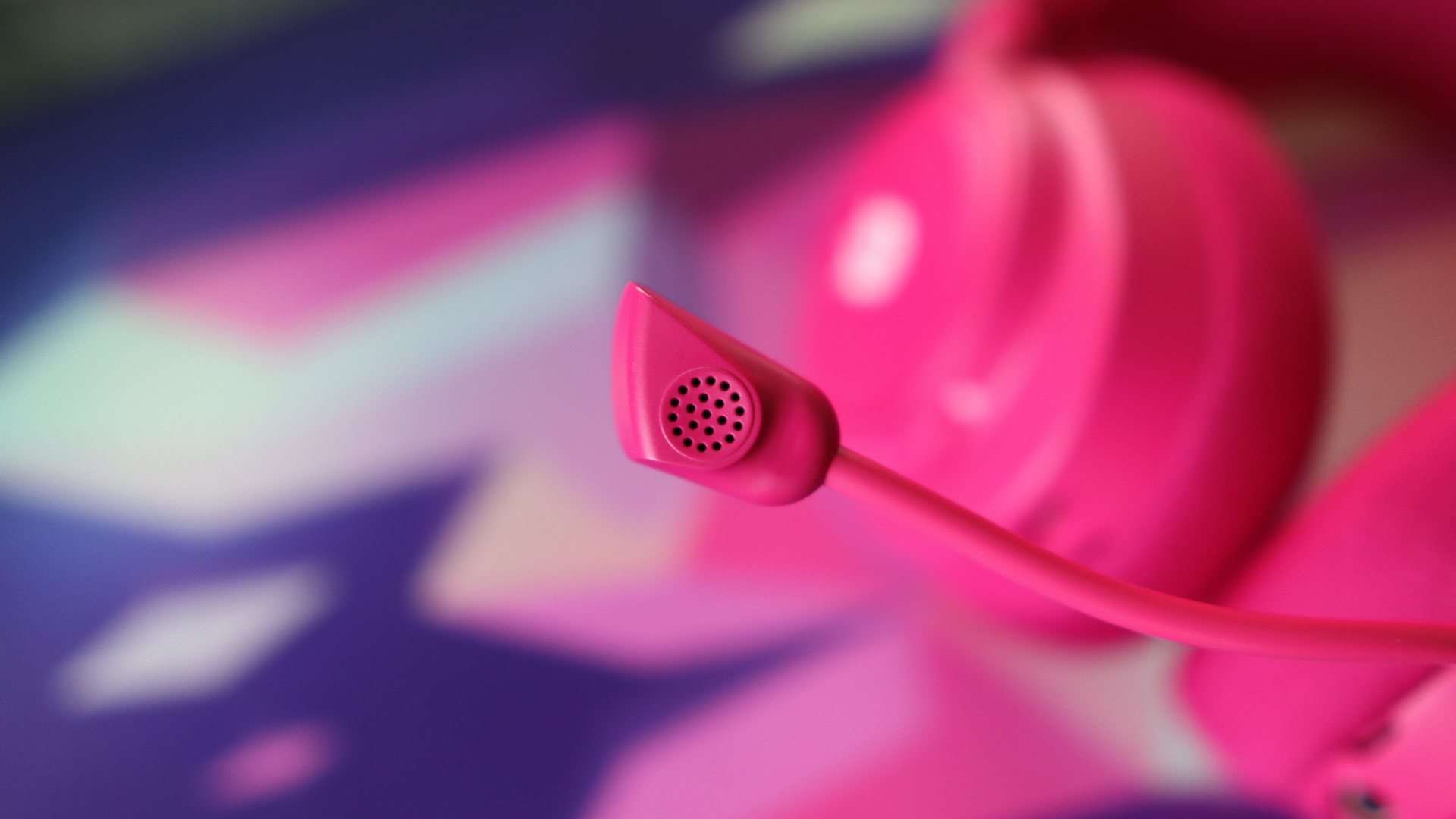 SteelSeries Arctis Nova 7X Wireless Gen 2 in pink on a mouse pad.
