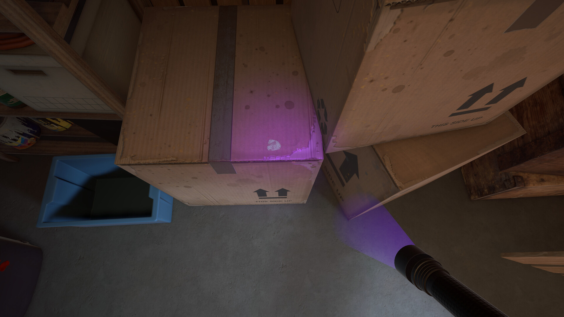 fingerprint on a box under a blacklight