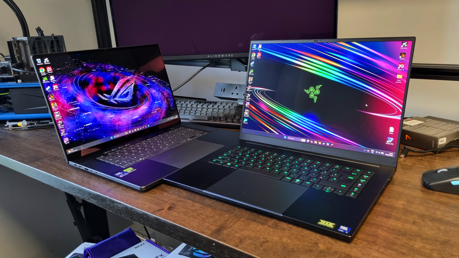 The Asus ROG Zephyrus G16 off to the side of the Razer Blade 16
