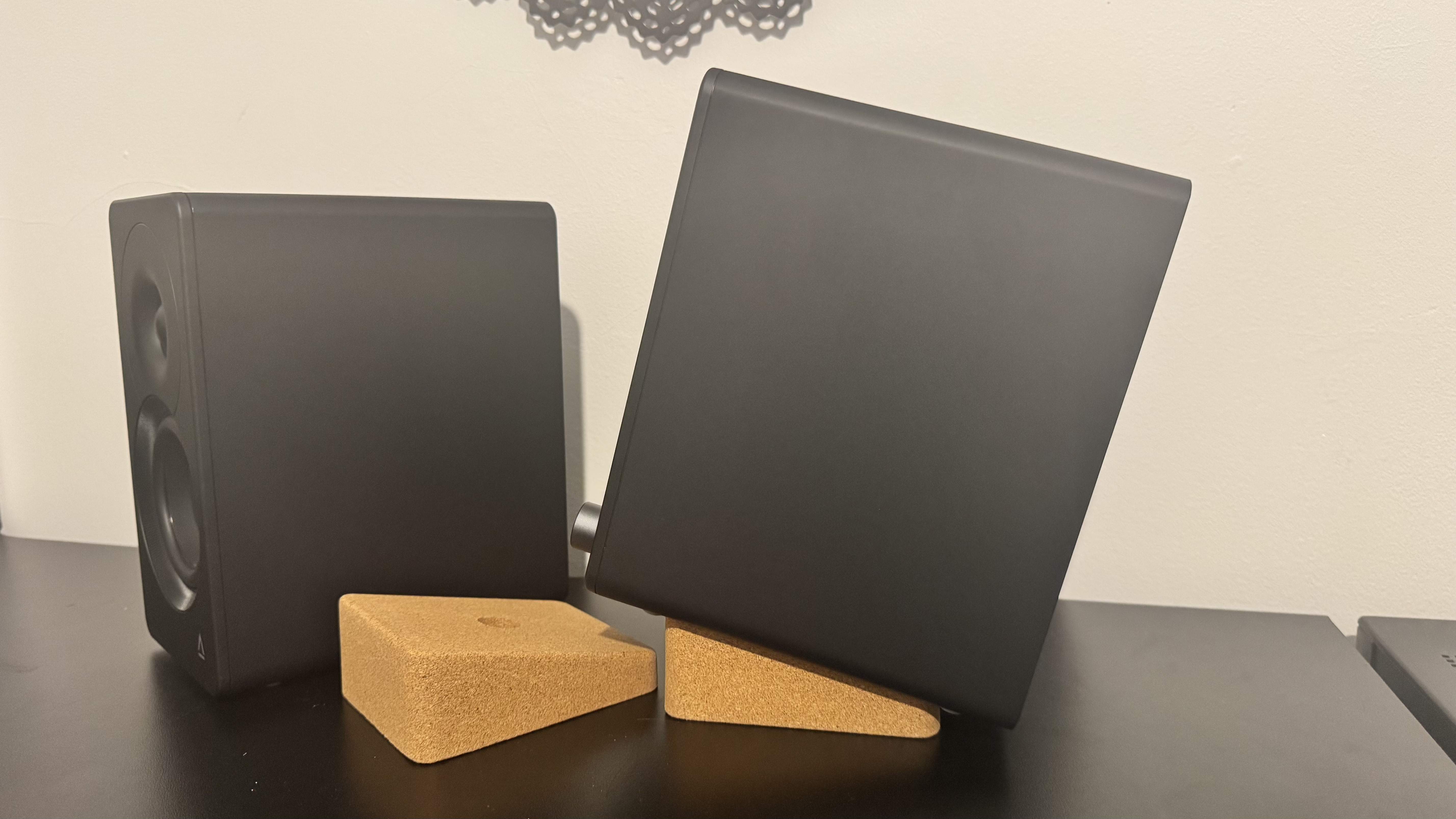 Creative XF1 speakers on a black desk