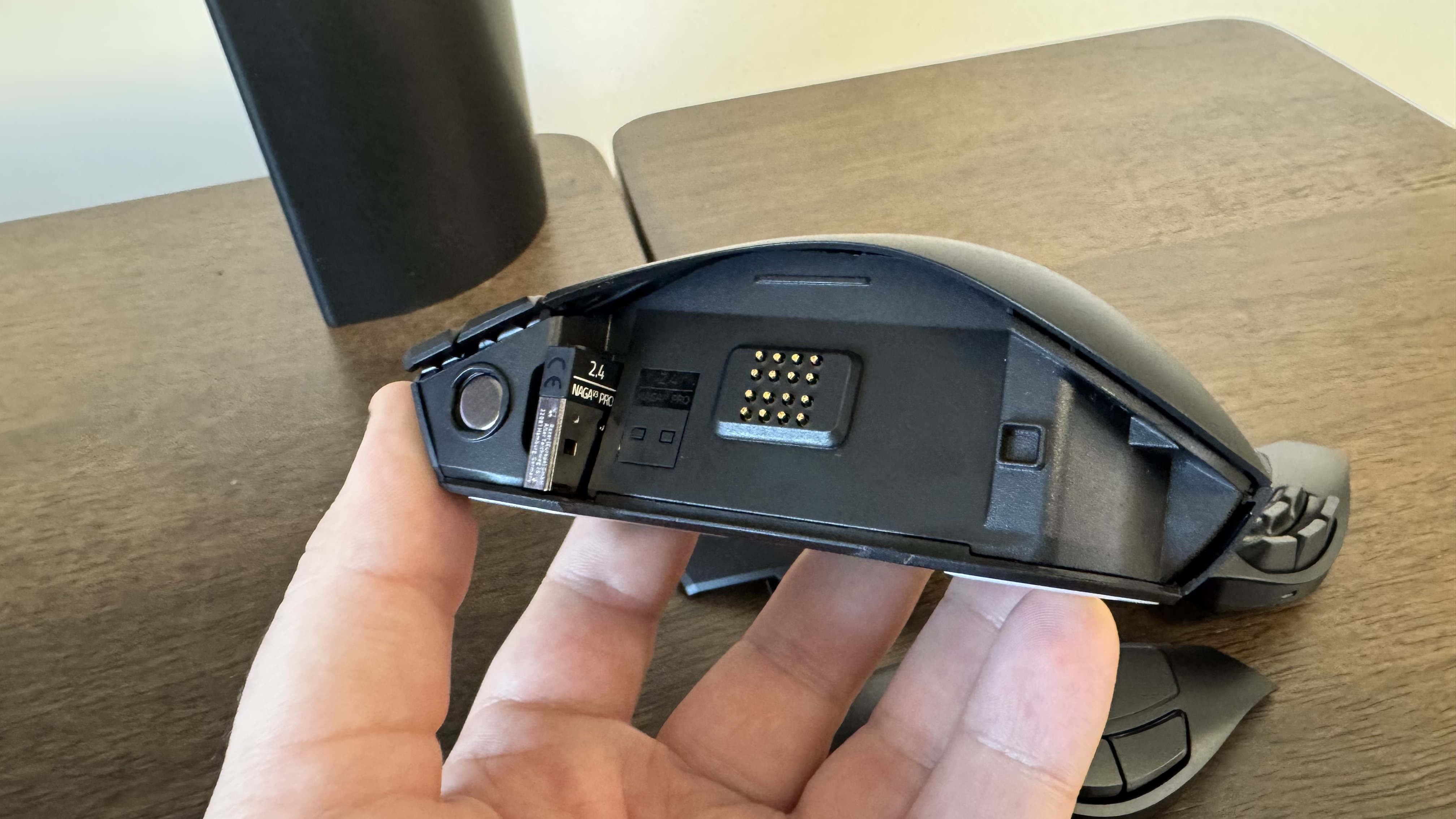 The Razer Naga V3 Pro without its faceplate, with the connector inside