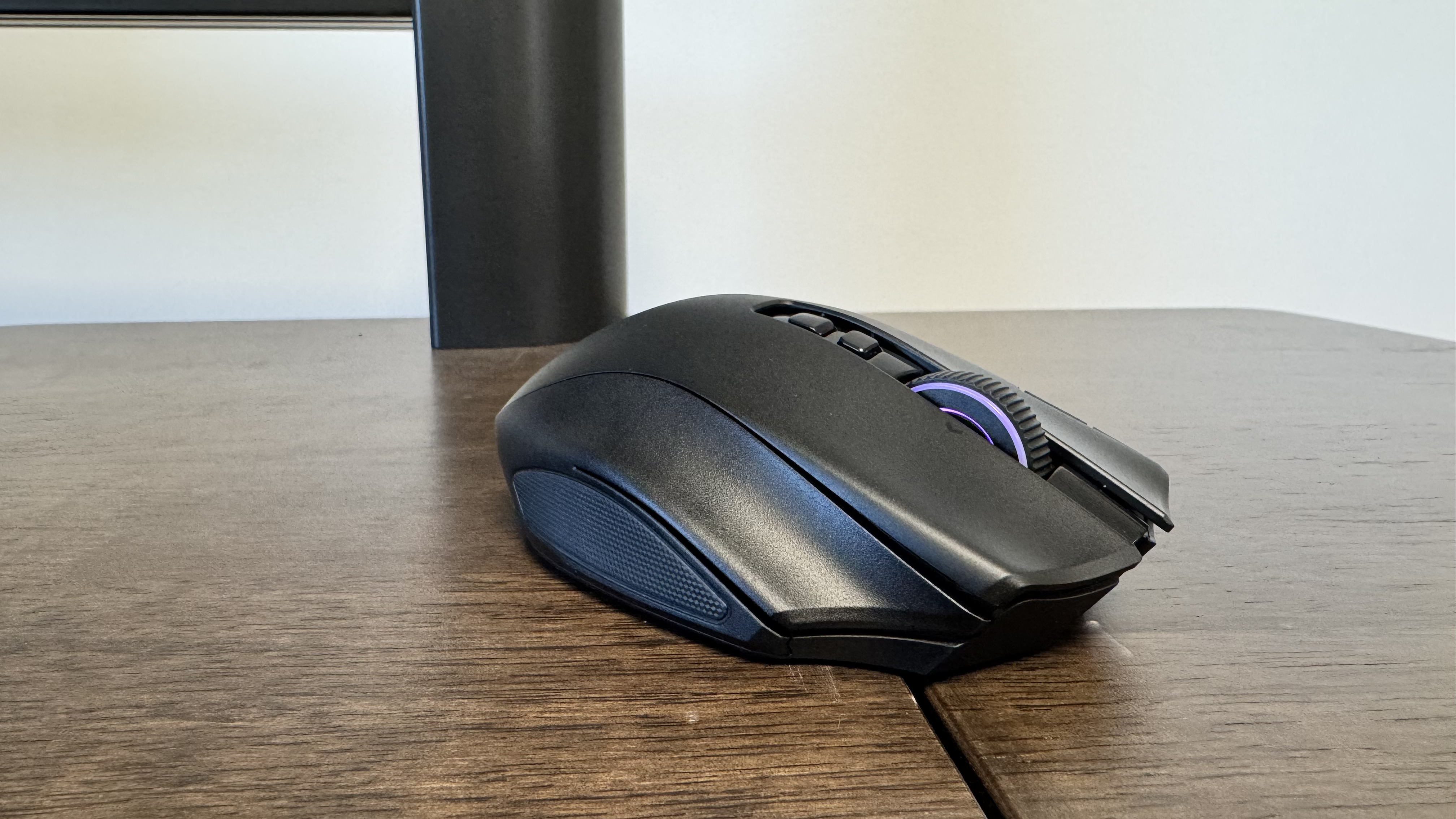 The Razer Naga V3 Pro on a wooden table