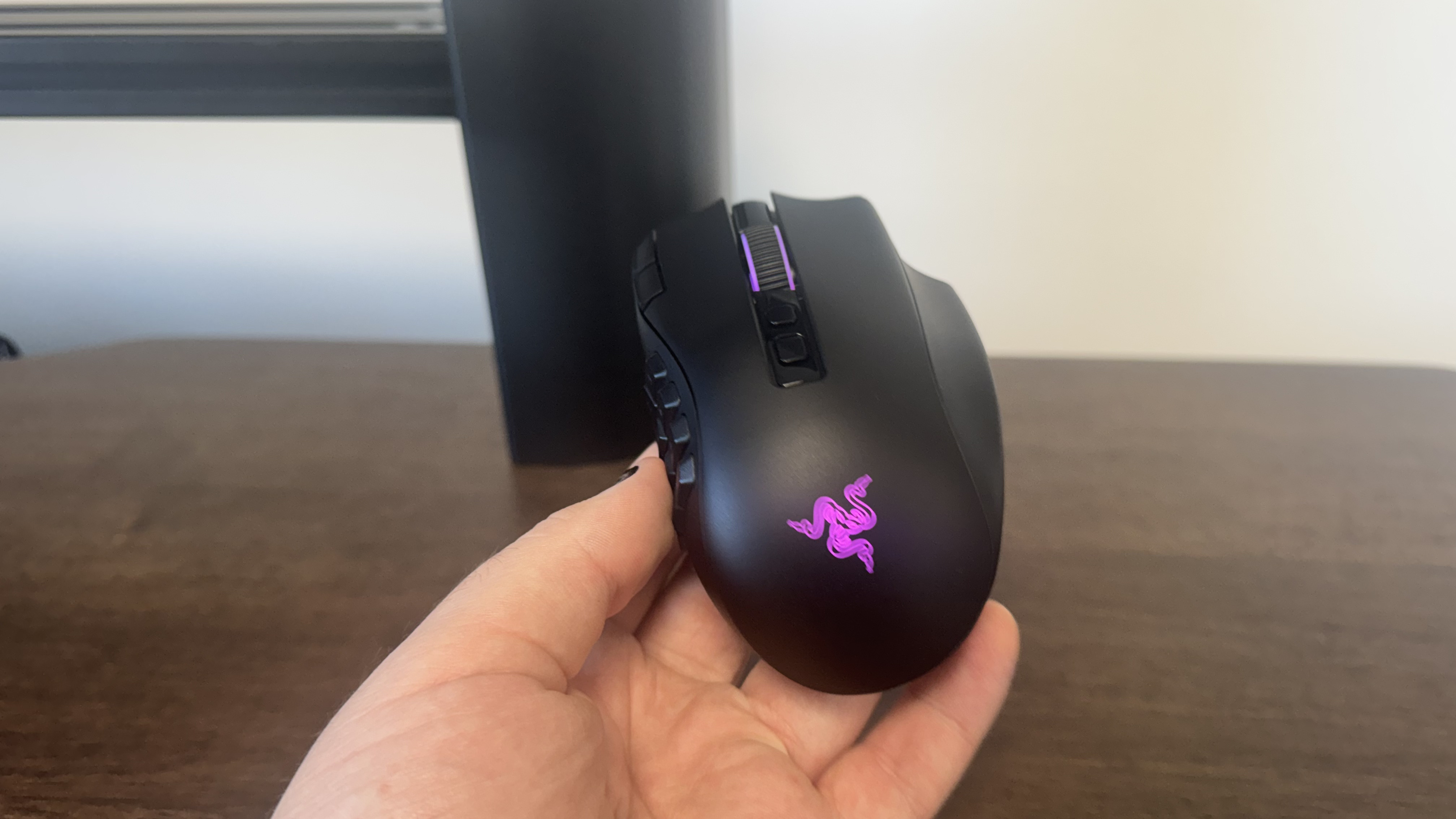 The Razer Naga V3 Pro on a wooden table