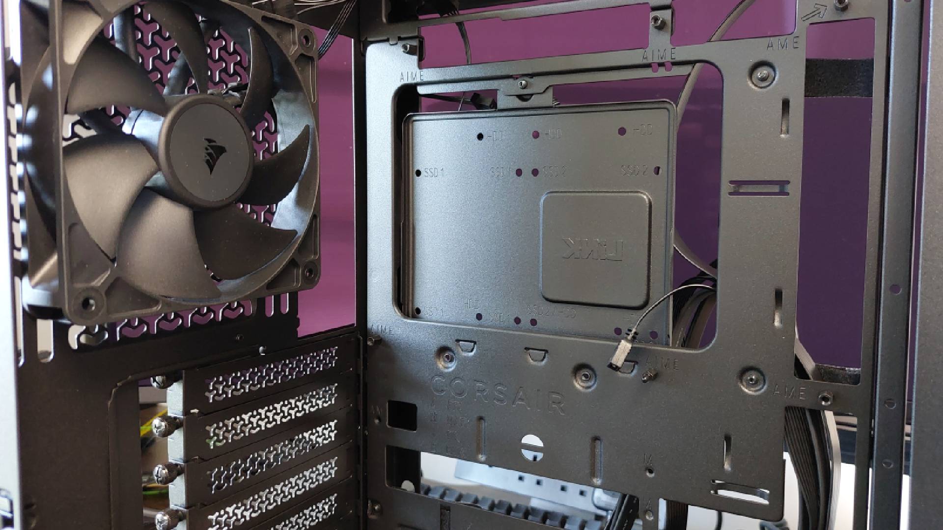 The Corsair Frame 4000X PC case seen at various stages of a PC build. This is a modular, mid-tower case with lots of options for customisation.