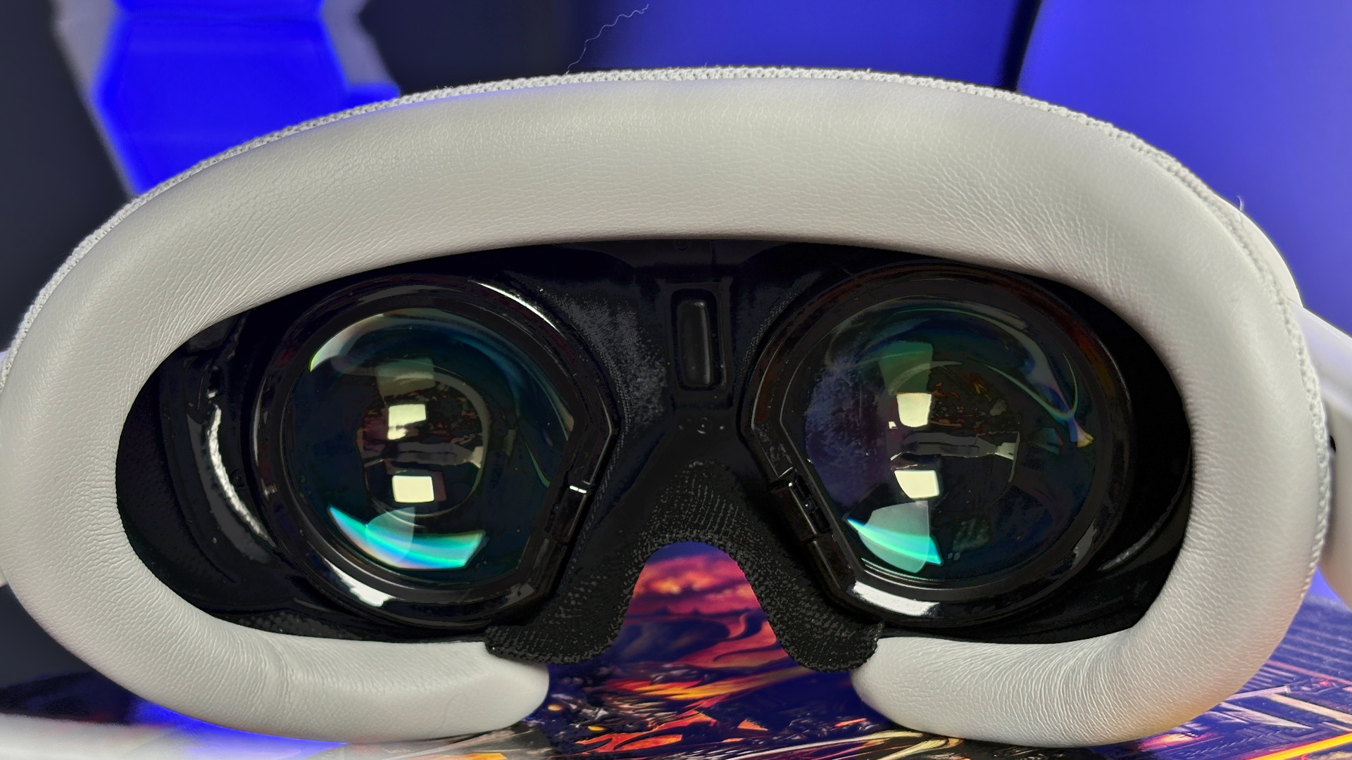 The Pimax Dream Air in white on a stack of PC Gamer magazine.