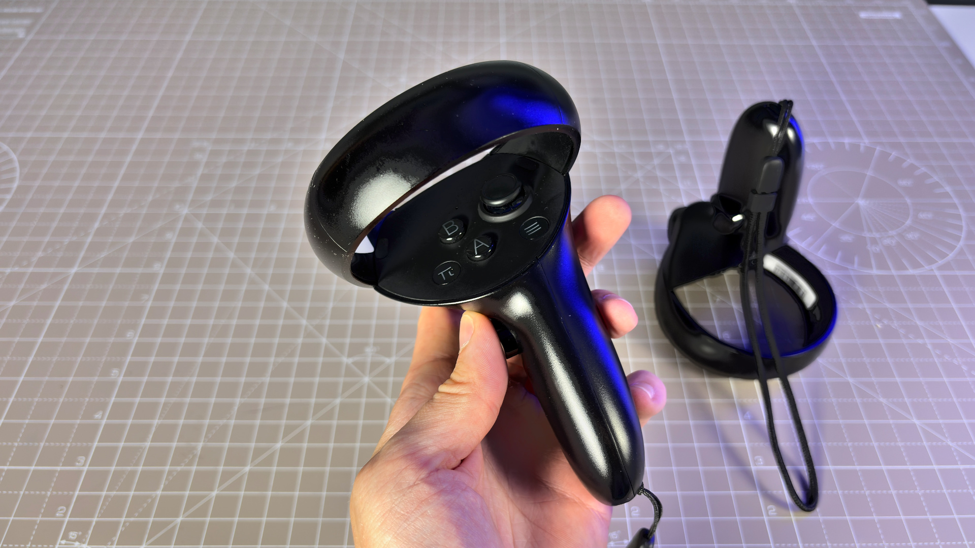 The Pimax Dream Air in white on a stack of PC Gamer magazine.
