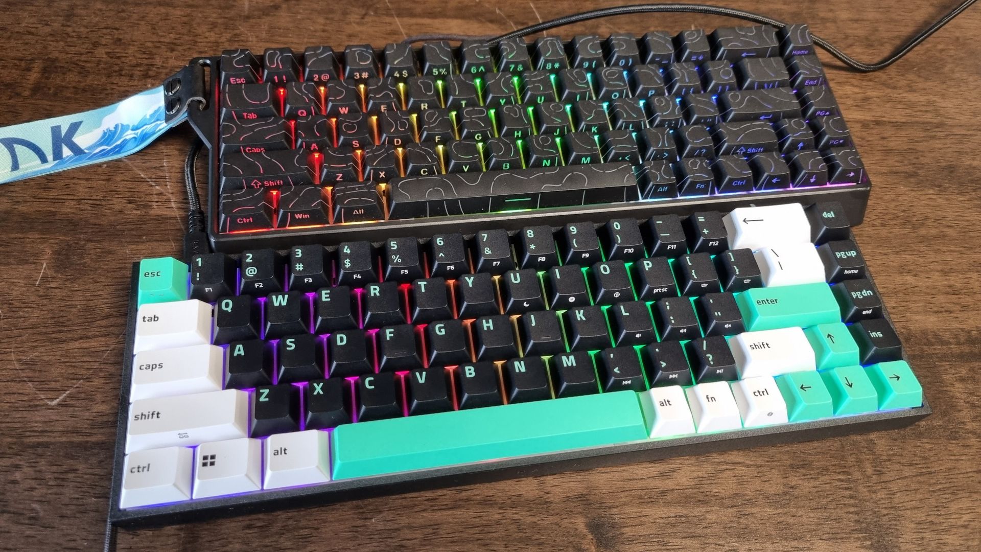 A Razer Reclusa X Mini 65% and a Gamakay x NaughShark NS68 gaming keyboard next to each other on a desk