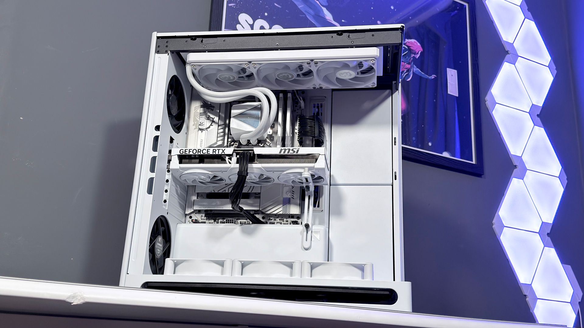 The Havn HS 360 PC case in black and white on a desk.