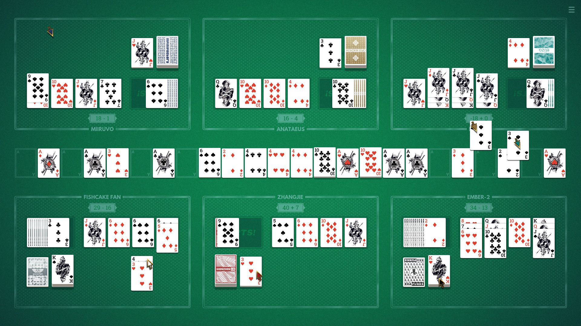 Six different games of solitaire on one green table.