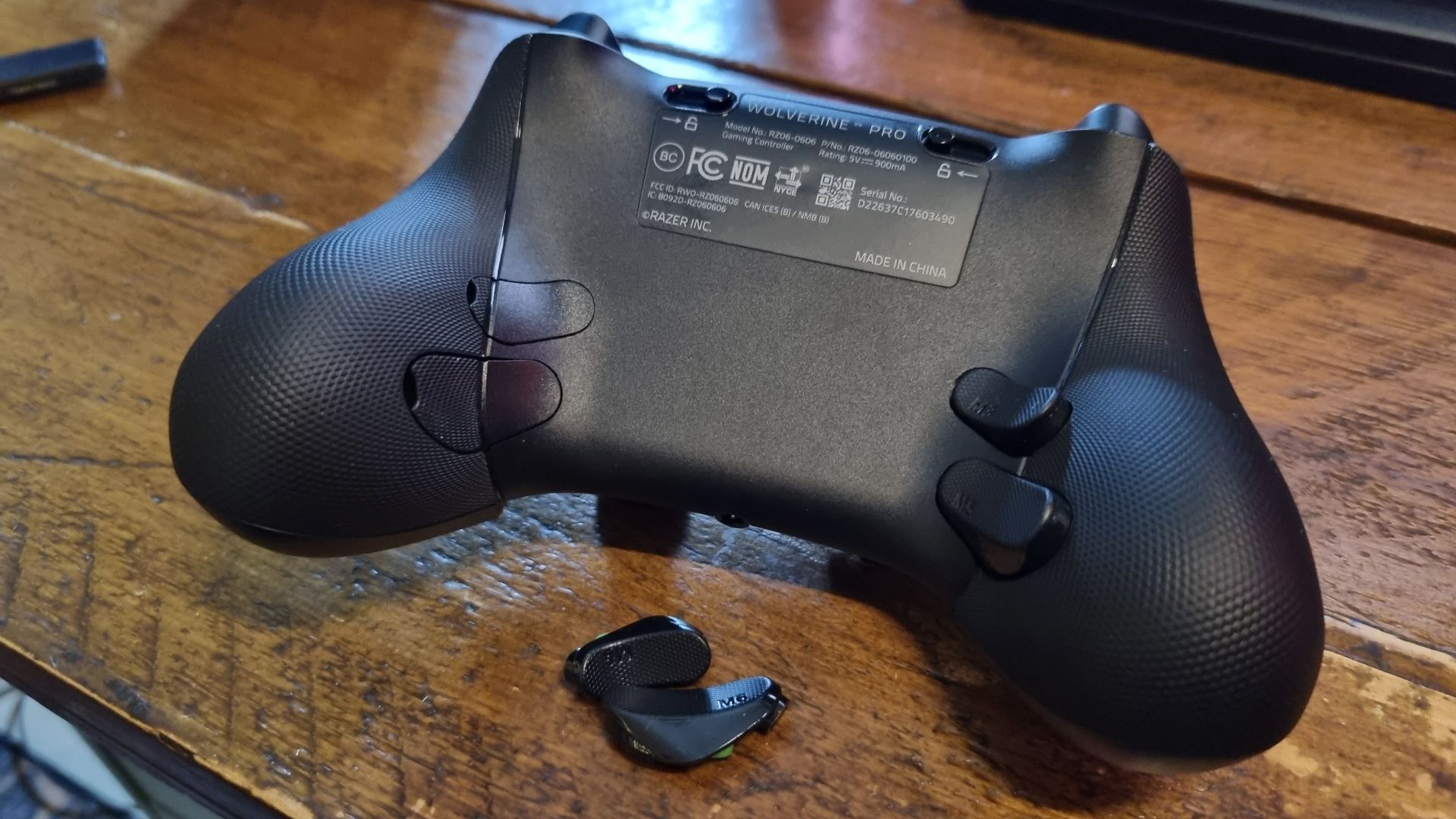 The rear of the Razer Wolverine V4 Pro, with half the rear paddle buttons blocked off