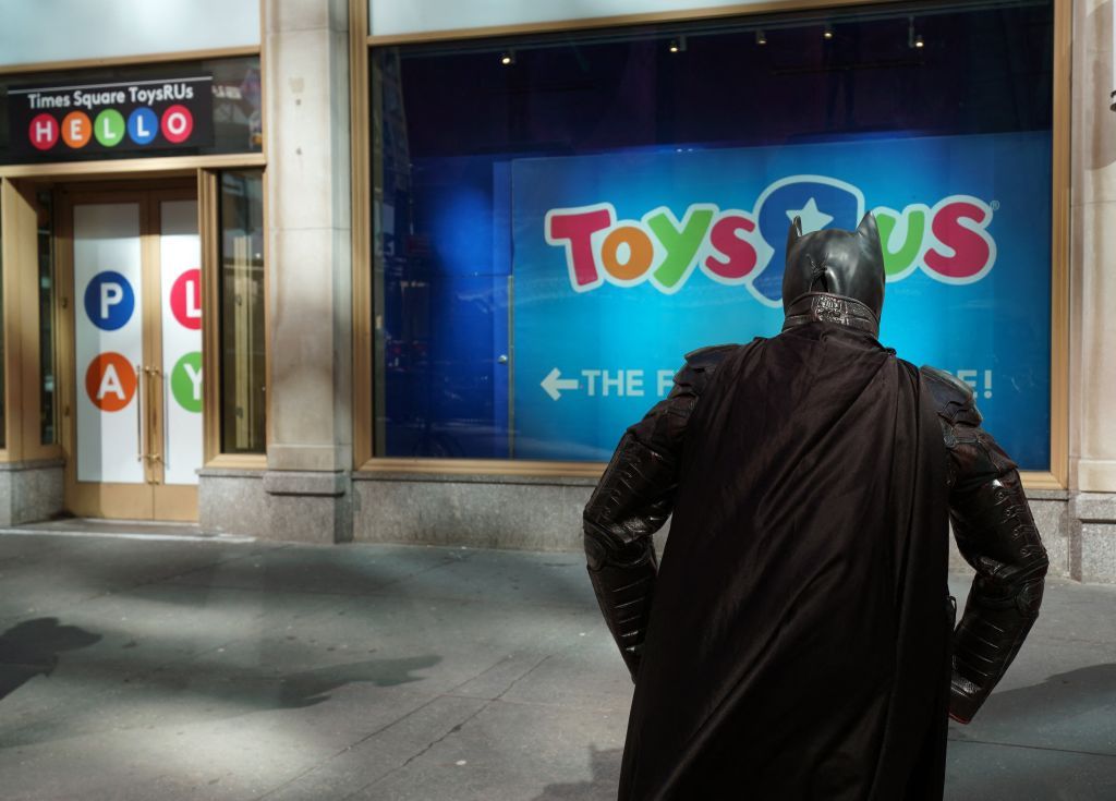 A Batman mascot waits to be interviewed by media at the Toys 'R' Us in Times Square March 15, 2018 in New York.